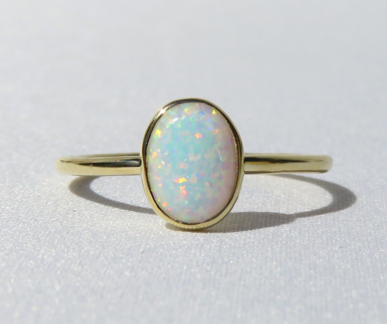 14k Gold 6x8mm Oval White Fire Opal Ring