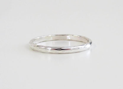 Silver ring on a light gray background
