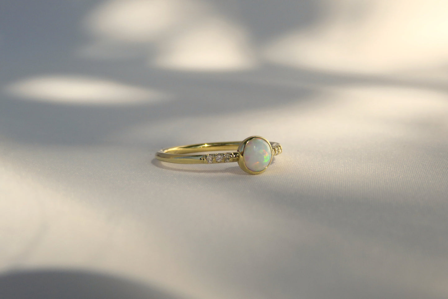 14k Gold 5mm Round White Fire Opal Ring with Diamond Accents