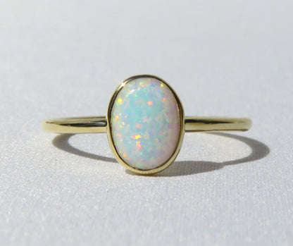 14k Gold 6x8mm Oval White Fire Opal Ring